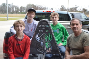 Connor Chancy, Brayden Whidden, Maddox Whidden show off their Bicycle Rack made with Larry Morts at Village Metalworks