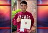 Student wearing Harvard sweatshirt holding acceptance letter