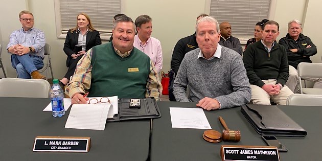 City Manager Mark Barber and Mayor Scott James Matheson at Public Meeting last week
