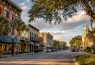 Historic downtown street with trees and buildings.
