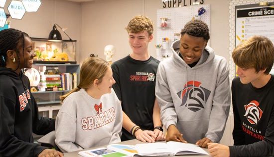 Students studying together in a classroom.