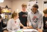 Students studying together in a classroom.