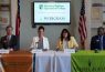 Four people at Wiregrass college signing table