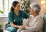 Nurse smiling with senior woman at home