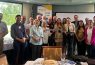 Group of people at a Rotary meeting.